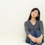 不幸を断ち切りたい女性