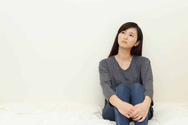 不幸を断ち切りたい女性